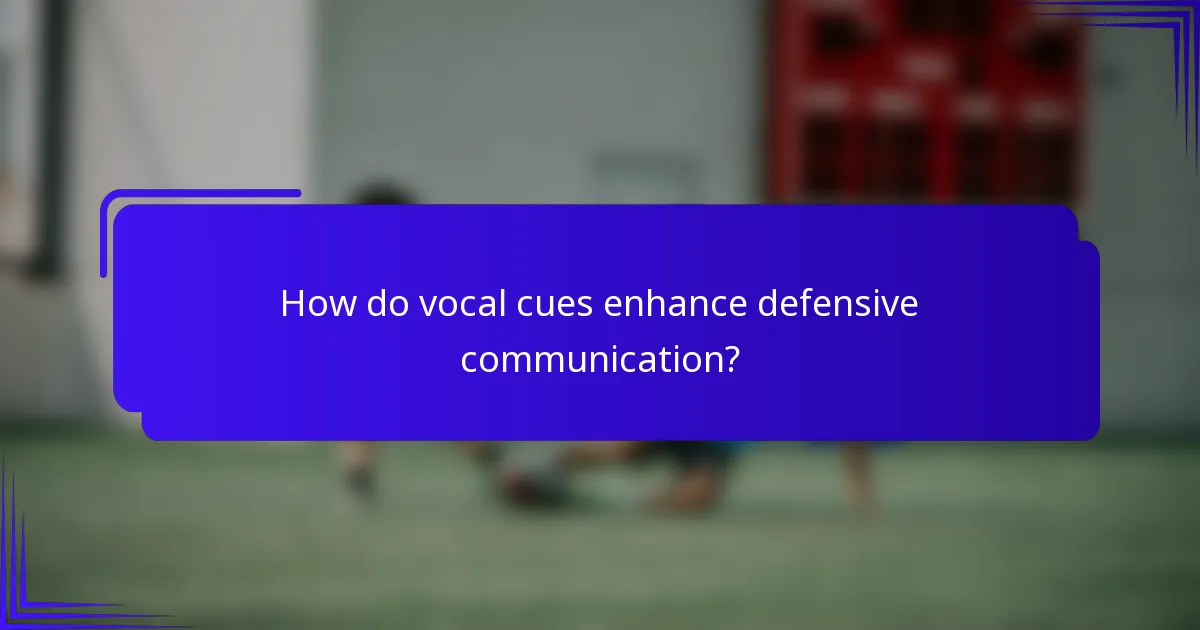 How do vocal cues enhance defensive communication?
